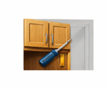 A blue-handled screwdriver placed over wooden kitchen cabinets, illustrating cabinet installation or repair services.